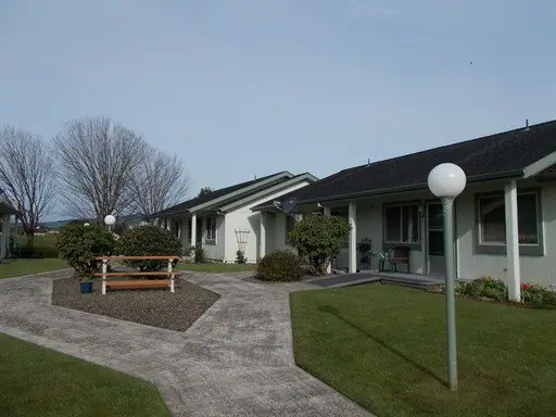 Courtyard with a picnic table, lamp posts and lawn