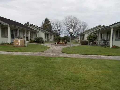 Lawn and paths between single-story buildings