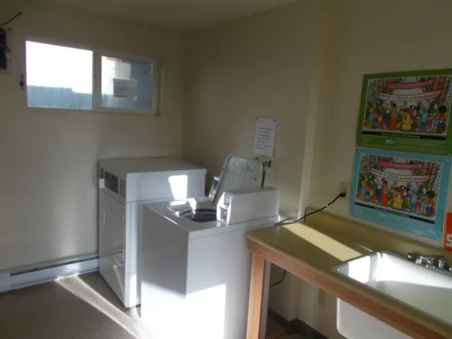 Laundry room with a washer, a dryer and a folding counter