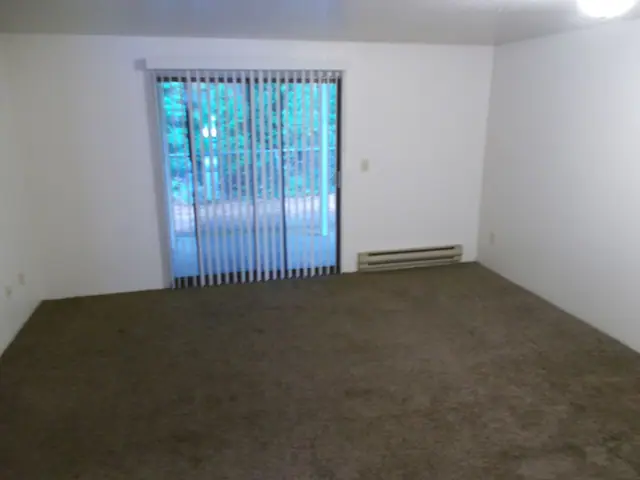 Empty living room with a sliding glass door
