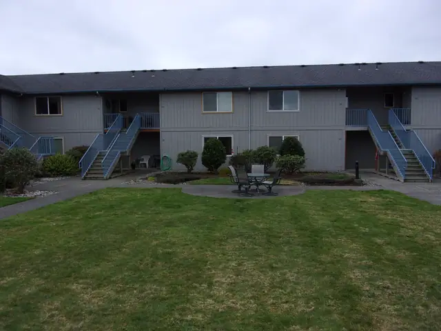 Courtyard lawn and outside stairs to the upper apartments