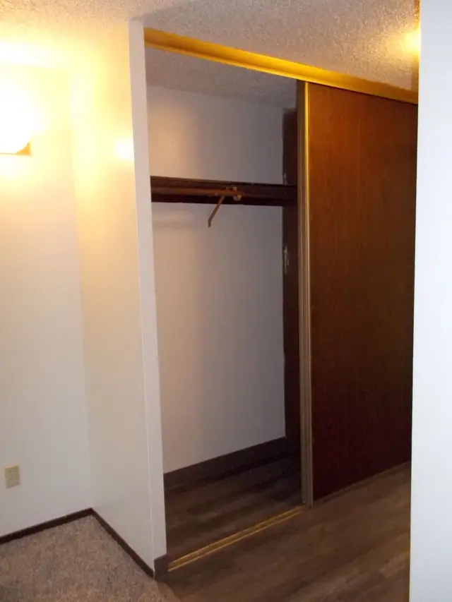 Closet with sliding doors and a clothes rod