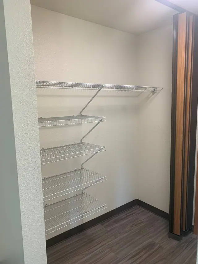 Closet with wire shelves and a folding door