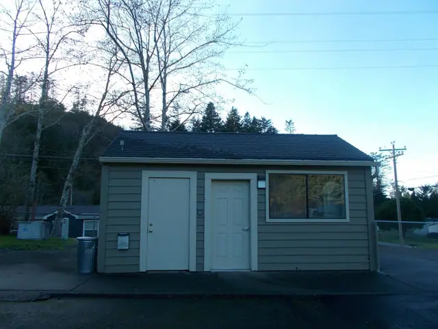 Small laundry building with two doors