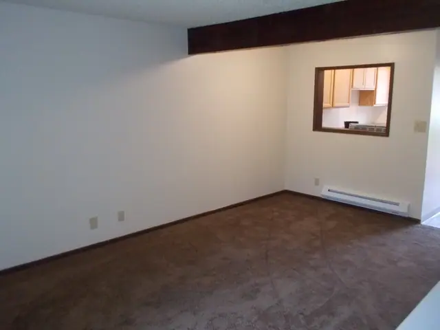 Living room with a pass-through window to the kitchen