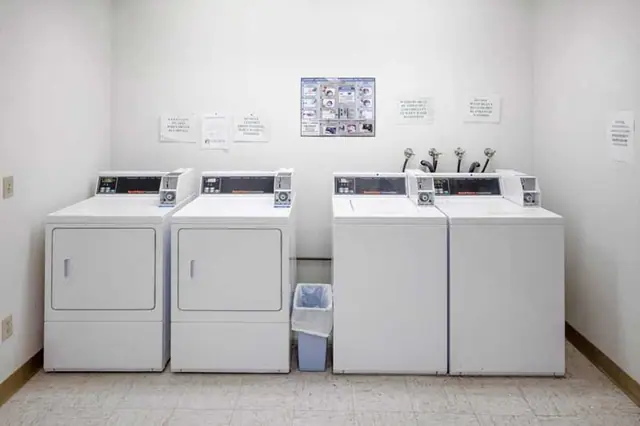Laundry room with washers and dryers