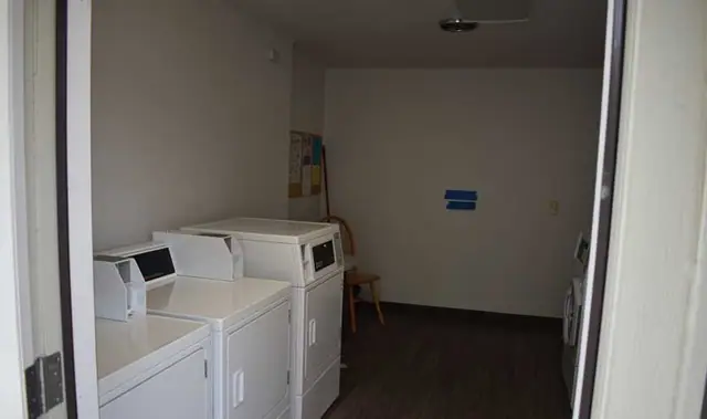 Laundry room with washers and dryers